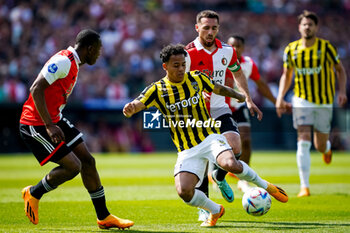 2023-05-28 - Neraysho Kasanwirjo of Feyenoord challenges Million Manhoef of Vitesse during the Netherlands championship Eredivisie football match between Feyenoord and Vitesse on May 28, 2023 at Stadion Feijenoord in Rotterdam, Netherlands - FOOTBALL - NETHERLANDS CHAMP - FEYENOORD V VITESSE - NETHERLANDS EREDIVISIE - SOCCER