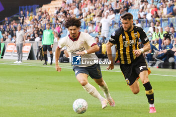 2023-08-19 - Andre Ramalho of PSV battles for the ball with Said Hamulic of Vitesse during the Netherlands championship Eredivisie football match between Vitesse and PSV on August 19, 2023 at GelreDome in Arnhem, Netherlands - FOOTBALL - NETHERLANDS CHAMP - VITESSE V PSV - NETHERLANDS EREDIVISIE - SOCCER