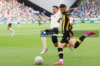 2023-08-19 - Olivier Boscagli of PSV battles for the ball with Said Hamulic of Vitesse during the Netherlands championship Eredivisie football match between Vitesse and PSV on August 19, 2023 at GelreDome in Arnhem, Netherlands - FOOTBALL - NETHERLANDS CHAMP - VITESSE V PSV - NETHERLANDS EREDIVISIE - SOCCER