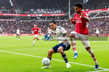 2023-10-29 - Gaston Avila of AFC Ajax battles for possession with Malik Tillman of PSV during the Netherlands championship Eredivisie football match between PSV and AFC Ajax on October 29, 2023 at Philips Stadion in Eindhoven, Netherlands - FOOTBALL - NETHERLANDS CHAMP - PSV V AJAX - NETHERLANDS EREDIVISIE - SOCCER