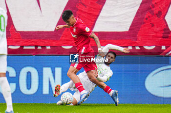 2023-10-29 - Mees Hilgers of FC Twente gets tackled by Luka Ivanusec of Feyenoord during the Netherlands championship Eredivisie football match between FC Twente and Feyenoord on October 29, 2023 at De Grolsch Veste in Enschede, Netherlands - FOOTBALL - NETHERLANDS CHAMP - TWENTE V FEYENOORD - NETHERLANDS EREDIVISIE - SOCCER
