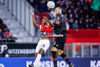 2023-10-29 - Richedly Bazoer of AZ, Bas Dost of NEC battle for the ball during the Netherlands championship Eredivisie football match between AZ and NEC on October 29, 2023 at AFAS Stadion in Alkmaar, Netherlands - FOOTBALL - NETHERLANDS CHAMP - AZ V NEC - NETHERLANDS EREDIVISIE - SOCCER