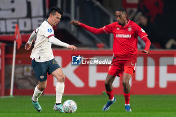 2023-11-25 - Hirving Lozano of PSV and Joshua Brenet of FC Twente during the Netherlands championship Eredivisie football match between FC Twente and PSV on November 25, 2023 at De Grolsch Veste in Enschede, Netherlands - FOOTBALL - NETHERLANDS CHAMP - TWENTE V PSV - NETHERLANDS EREDIVISIE - SOCCER