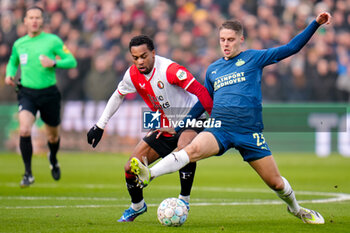 2023-12-03 - Quinten Timber of Feyenoord battles for possession with Joey Veerman of PSV during the Netherlands championship Eredivisie football match between Feyenoord and PSV on December 3, 2023 at Stadion Feijenoord in Rotterdam, Netherlands - FOOTBALL - NETHERLANDS CHAMP - FEYENOORD V PSV - NETHERLANDS EREDIVISIE - SOCCER