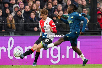 2023-12-03 - Mats Wieffer of Feyenoord is challenged by Johan Bakayoko of PSV during the Netherlands championship Eredivisie football match between Feyenoord and PSV on December 3, 2023 at Stadion Feijenoord in Rotterdam, Netherlands - FOOTBALL - NETHERLANDS CHAMP - FEYENOORD V PSV - NETHERLANDS EREDIVISIE - SOCCER