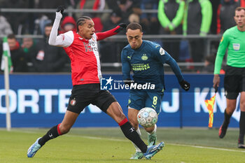 2023-12-03 - Sergino Dest of PSV battles for the ball with Calvin Stengs of Feyenoord during the Netherlands championship Eredivisie football match between Feyenoord and PSV on December 3, 2023 at Stadion Feijenoord in Rotterdam, Netherlands - FOOTBALL - NETHERLANDS CHAMP - FEYENOORD V PSV - NETHERLANDS EREDIVISIE - SOCCER