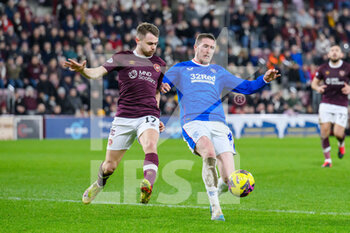 2023-02-01 - John Lundstram of Rangers and Alan Forrest of Hearts during the Scottish championship, Cinch SPFL Premiership football match between Heart of Midlothian and Rangers on February 1, 2023 at Tynecastle Park in Edinburgh, Scotland - FOOTBALL - SCOTTISH CHAMP - HEART OF MIDLOTHIAN V RANGERS - SCOTTISH PREMIERSHIP - SOCCER