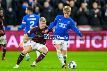 2023-12-06 - Ross McCausland of Rangers and Alex Cochrane of Hearts during the Scottish championship Premiership football match between Heart of Midlothian and Rangers on 6 December 2023 at Tynecastle Park in Edinburgh, Scotland - FOOTBALL - SCOTTISH CHAMP - HEART OF MIDLOTHIAN V RANGERS - SCOTTISH PREMIERSHIP - SOCCER
