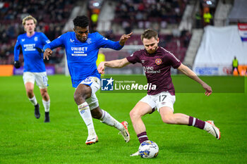 2023-12-06 - Alan Forrest of Hearts and Jose Cifuentes of Rangers during the Scottish championship Premiership football match between Heart of Midlothian and Rangers on 6 December 2023 at Tynecastle Park in Edinburgh, Scotland - FOOTBALL - SCOTTISH CHAMP - HEART OF MIDLOTHIAN V RANGERS - SCOTTISH PREMIERSHIP - SOCCER