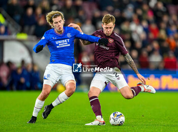 2023-12-06 - Frankie Kent of Hearts and Todd Cantwell of Rangers during the Scottish championship Premiership football match between Heart of Midlothian and Rangers on 6 December 2023 at Tynecastle Park in Edinburgh, Scotland - FOOTBALL - SCOTTISH CHAMP - HEART OF MIDLOTHIAN V RANGERS - SCOTTISH PREMIERSHIP - SOCCER