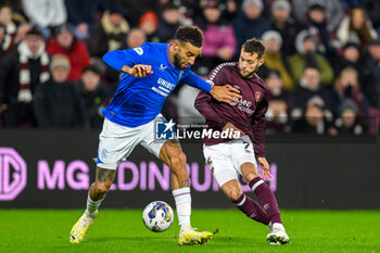 2023-12-06 - Connor Goldson of Rangers and Jorge Grant of Hearts during the Scottish championship Premiership football match between Heart of Midlothian and Rangers on 6 December 2023 at Tynecastle Park in Edinburgh, Scotland - FOOTBALL - SCOTTISH CHAMP - HEART OF MIDLOTHIAN V RANGERS - SCOTTISH PREMIERSHIP - SOCCER