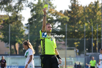 2023-10-01 - The match referee Gianluca Renzi draws the yellow card. - US SASSUOLO VS POMIGLIANO WOMEN - ITALIAN SERIE A WOMEN - SOCCER