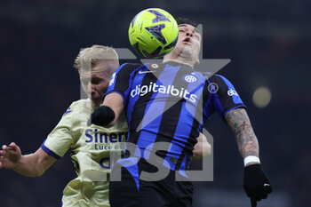 2023-01-14 - Lautaro Martinez of FC Internazionale competes for the ball with Josh Doig of Hellas Verona FC during Serie A 2022/23 football match between FC Internazionale and Hellas Verona FC at Giuseppe Meazza Stadium, Milan, Italy on January 14, 2023 - INTER - FC INTERNAZIONALE VS HELLAS VERONA - ITALIAN SERIE A - SOCCER