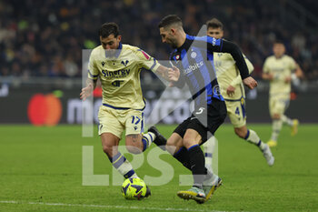 2023-01-14 - Roberto Gagliardini of FC Internazionale competes for the ball with Federico Ceccherini of Hellas Verona FC during Serie A 2022/23 football match between FC Internazionale and Hellas Verona FC at Giuseppe Meazza Stadium, Milan, Italy on January 14, 2023 - INTER - FC INTERNAZIONALE VS HELLAS VERONA - ITALIAN SERIE A - SOCCER