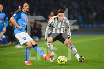 2023-01-13 - Mario Rui of SSC Napoli  competes for the ball with Federico Chiesa of Juventus FC during the Serie A match between SSC Napoli v Juventus FC  at  Stadio Diego Armando Maradona  - SSC NAPOLI VS JUVENTUS FC - ITALIAN SERIE A - SOCCER
