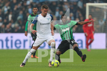 2023-01-15 - Hamed Junior Traoré of US Sassuolo Calcio competes for the ball with Sergej Milinković-Savić of SS Lazio during the Serie A match between US Sassuolo Calcio and SS Lazio at Mapei Stadium - Città del Tricolore on January 15, 2023 in Reggio Emilia, Italy. - US SASSUOLO VS SS LAZIO - ITALIAN SERIE A - SOCCER