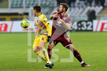 2023-01-15 - Mehdi Bourabia (Spezia Calcio) in action against Karol Linetty (Torino FC) - TORINO FC VS SPEZIA CALCIO - ITALIAN SERIE A - SOCCER