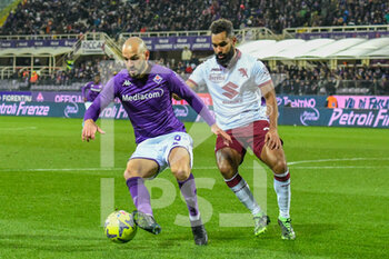 2023-01-21 - Fiorentina's Riccardo Saponara hampered by Torino's Koffi Djidji - ACF FIORENTINA VS TORINO FC - ITALIAN SERIE A - SOCCER
