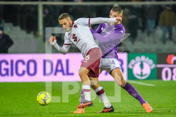 2023-01-21 - Torino's Nikola Vlasic fights for the ball against Fiorentina's Nikola Milenković - ACF FIORENTINA VS TORINO FC - ITALIAN SERIE A - SOCCER