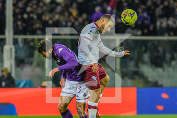 2023-01-21 - header of Torino's Nikola Vlasic against Fiorentina's Lorenzo Venuti - ACF FIORENTINA VS TORINO FC - ITALIAN SERIE A - SOCCER