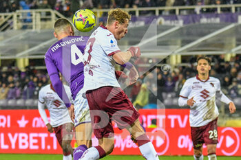 2023-01-21 - header of Fiorentina's Nikola Milenković against Torino's Mergin VojVoda - ACF FIORENTINA VS TORINO FC - ITALIAN SERIE A - SOCCER