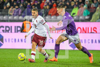 2023-01-21 - Torino's Nikola Vlasic fights for the ball against Fiorentina's Nikola Milenković - ACF FIORENTINA VS TORINO FC - ITALIAN SERIE A - SOCCER