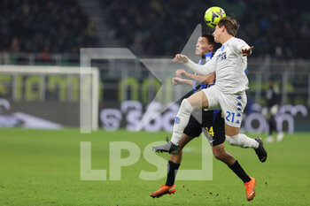 23/01/2023 - Kristjan Asllani of FC Internazionale competes for the ball with Jacopo Fazzini of Empoli FC during Serie A 2022/23 football match between FC Internazionale and Empoli FC at Giuseppe Meazza Stadium, Milan, Italy on January 23, 2023 - INTER - FC INTERNAZIONALE VS EMPOLI FC - SERIE A - CALCIO