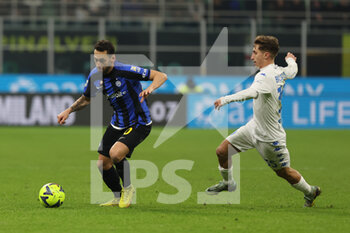 23/01/2023 - Hakan Calhanoglu of FC Internazionale competes for the ball with Tommaso Baldanzi of Empoli FC during Serie A 2022/23 football match between FC Internazionale and Empoli FC at Giuseppe Meazza Stadium, Milan, Italy on January 23, 2023 - INTER - FC INTERNAZIONALE VS EMPOLI FC - SERIE A - CALCIO