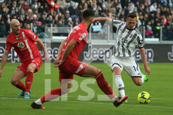2023-01-29 - Arkadiusz Milik (Juventus FC) in action against Pablo Mari (AC Monza) and Luca Caldirola (AC Monza) about to shoot the ball - JUVENTUS FC VS AC MONZA - ITALIAN SERIE A - SOCCER