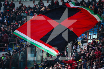 2023-01-29 - A fan waves a giant flag during Serie A 2022/23 football match between AC Milan and US Sassuolo at San Siro Stadium, Milan, Italy on January 29, 2023 - AC MILAN VS US SASSUOLO - ITALIAN SERIE A - SOCCER