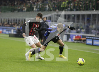 2023-02-05 - Theo Hernandez of AC Milan and Nicolo Barella of FC Internazionale during the Italian serie A, football match between Internazionale Fc and Ac Milan on 05 February 2023 at San Siro Stadium, Milan, Italy. Photo Ndrerim Kaceli - INTER - FC INTERNAZIONALE VS AC MILAN - ITALIAN SERIE A - SOCCER