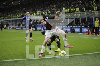 2023-02-05 - Alexis Saelemaekers of AC Milan and Nicolo Barella of FC Internazionale during the Italian serie A, football match between Internazionale Fc and Ac Milan on 05 February 2023 at San Siro Stadium, Milan, Italy. Photo Ndrerim Kaceli - INTER - FC INTERNAZIONALE VS AC MILAN - ITALIAN SERIE A - SOCCER