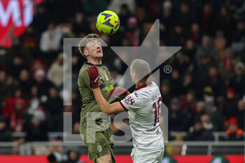 2023-02-10 - Alexis Saelemaekers of AC Milan competes for the ball with Nikola Vlasic of Torino FC during Serie A 2022/23 football match between AC Milan and Torino FC at San Siro Stadium, Milan, Italy on February 10, 2023 - AC MILAN VS TORINO FC - ITALIAN SERIE A - SOCCER