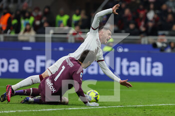 2023-02-10 - Antonio Sanabria of Torino FC competes for the ball with Ciprian Tatarusanu of AC Milan during Serie A 2022/23 football match between AC Milan and Torino FC at San Siro Stadium, Milan, Italy on February 10, 2023 - AC MILAN VS TORINO FC - ITALIAN SERIE A - SOCCER