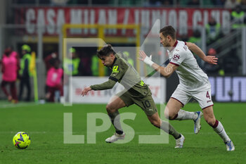 2023-02-10 - Brahim Diaz of AC Milan competes for the ball with Alessandro Buongiorno of Torino FC during Serie A 2022/23 football match between AC Milan and Torino FC at San Siro Stadium, Milan, Italy on February 10, 2023 - AC MILAN VS TORINO FC - ITALIAN SERIE A - SOCCER