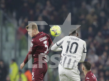 2023-02-28 - Perr Schuurs of Torino FC and Paul Pogba of Juventus during the Italian Serie A, football match between Juventus Fc and Torino Fc, on 28 February 2023 at Allianz Stadium, Turin, Italy. Photo Ndrerim Kaceli - JUVENTUS FC VS TORINO FC - ITALIAN SERIE A - SOCCER