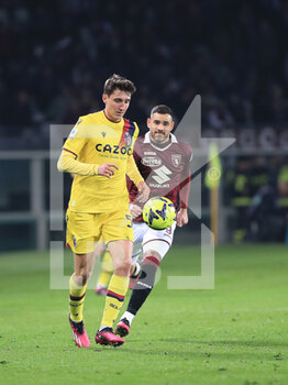 2023-03-06 - Andrea Cambiaso (Bologna FC) in action against Antonio Sanabria (Torino FC) - TORINO FC VS BOLOGNA FC - ITALIAN SERIE A - SOCCER