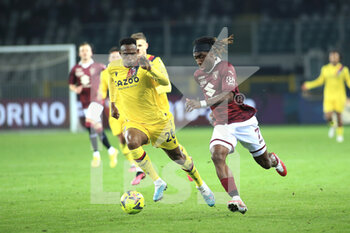 2023-03-06 - Jhon Lucumi (Bologna FC) in action against Yann Karamoh (Torino FC) - TORINO FC VS BOLOGNA FC - ITALIAN SERIE A - SOCCER