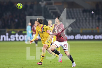2023-03-06 - Andrea Cambiaso (Bologna FC) in action against Nemanja Radonjic (Torino FC) - TORINO FC VS BOLOGNA FC - ITALIAN SERIE A - SOCCER