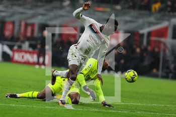 2023-03-13 - Boulaye Dia of US Salernitana 1919 competes for the ball with Mike Maignan of AC Milan during Serie A 2022/23 football match between AC Milan and US Salernitana 1919 at San Siro Stadium, Milan, Italy on March 13, 2023 - AC MILAN VS US SALERNITANA - ITALIAN SERIE A - SOCCER