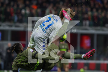 2023-04-07 - Rafael Leao of AC Milan and Jacopo Fazzini of Empoli FC in action during Serie A 2022/23 football match between AC Milan and Empoli FC at San Siro Stadium, Milan, Italy on April 07, 2023 - AC MILAN VS EMPOLI FC - ITALIAN SERIE A - SOCCER