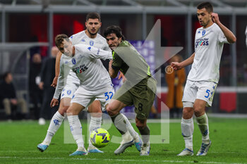 2023-04-07 - Sandro Tonali of AC Milan competes for the ball with Nicolas Haas of Empoli FC during Serie A 2022/23 football match between AC Milan and Empoli FC at San Siro Stadium, Milan, Italy on April 07, 2023 - AC MILAN VS EMPOLI FC - ITALIAN SERIE A - SOCCER