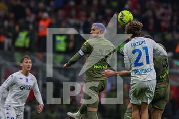 2023-04-07 - Theo Hernandez of AC Milan and Jacopo Fazzini of Empoli FC in action during Serie A 2022/23 football match between AC Milan and Empoli FC at San Siro Stadium, Milan, Italy on April 07, 2023 - AC MILAN VS EMPOLI FC - ITALIAN SERIE A - SOCCER