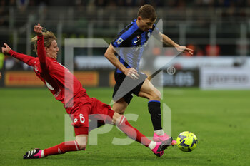 2023-04-15 - Nicolo Barella of FC Internazionale competes for the ball with Nicolo Rovella of AC Monza during Serie A 2022/23 football match between FC Internazionale and AC Monza at Giuseppe Meazza Stadium, Milan, Italy on April 15, 2023 - INTER - FC INTERNAZIONALE VS AC MONZA - ITALIAN SERIE A - SOCCER