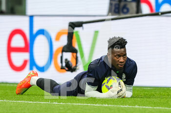 2023-04-15 - Andre Onana of FC Internazionale warms up during Serie A 2022/23 football match between FC Internazionale and AC Monza at Giuseppe Meazza Stadium, Milan, Italy on April 15, 2023 - INTER - FC INTERNAZIONALE VS AC MONZA - ITALIAN SERIE A - SOCCER