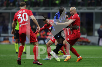 2023-04-15 - Romelu Lukaku of FC Internazionale competes for the ball with Luca Caldirola of AC Monza and Matteo Pessina of AC Monza during Serie A 2022/23 football match between FC Internazionale and AC Monza at Giuseppe Meazza Stadium, Milan, Italy on April 15, 2023 - INTER - FC INTERNAZIONALE VS AC MONZA - ITALIAN SERIE A - SOCCER