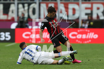 2023-04-23 - Brahim Diaz of AC Milan competes for the ball with Federico Di Francesco of US Lecce during Serie A 2022/23 football match between AC Milan and US Lecce at San Siro Stadium, Milan, Italy on April 23, 2023 - AC MILAN VS US LECCE - ITALIAN SERIE A - SOCCER