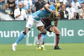 2023-04-30 - Victor Osimhen of SSC Napoli competes for the ball with Flavius Daniliuc of US Salernitana during the Serie A match between SSC Napoli vs US Salernitana 1919 at Diego Armando Maradano Stadium - SSC NAPOLI VS US SALERNITANA - ITALIAN SERIE A - SOCCER