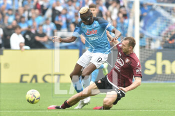 2023-04-30 - Victor Osimhen of SSC Napoli competes for the ball with Norbert Gyomber of US Salernitana during the Serie A match between SSC Napoli vs US Salernitana 1919 at Diego Armando Maradano Stadium - SSC NAPOLI VS US SALERNITANA - ITALIAN SERIE A - SOCCER