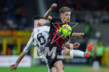 2023-05-03 - Alexis Saelemaekers of AC Milan competes for the ball with Paolo Bartolomei of US Cremonese during Serie A 2022/23 football match between AC Milan and US Cremonese at San Siro Stadium, Milan, Italy on May 03, 2023 - AC MILAN VS US CREMONESE - ITALIAN SERIE A - SOCCER